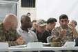 From left, U.S. Army Maj. Erick Malaske, operations officer, 1st Battalion, 68th Armor Regiment, 3rd Armored Brigade Combat Team, 4th Infantry Division, Task Force Spartan; Lt. Col. Omar Minott, commander, 1st Squadron, 102nd Cavalry Regiment, 44th Infantry Brigade Combat Team, New Jersey Army National Guard; Jordanian Armed Forces Lt. Col. Saif Al Khawaldeh, commander, 39th Mechanized Infantry Battalion; discuss upcoming operations for exercise Eager Lion 19. This multinational exercise is U.S. Central Command’s premiere exercise in the Levant region and is a major training event that provides U.S. forces, Jordan Armed Forces and 23 other participating nations the opportunity to improve their collective ability to plan and operate in a coalition-type environment.