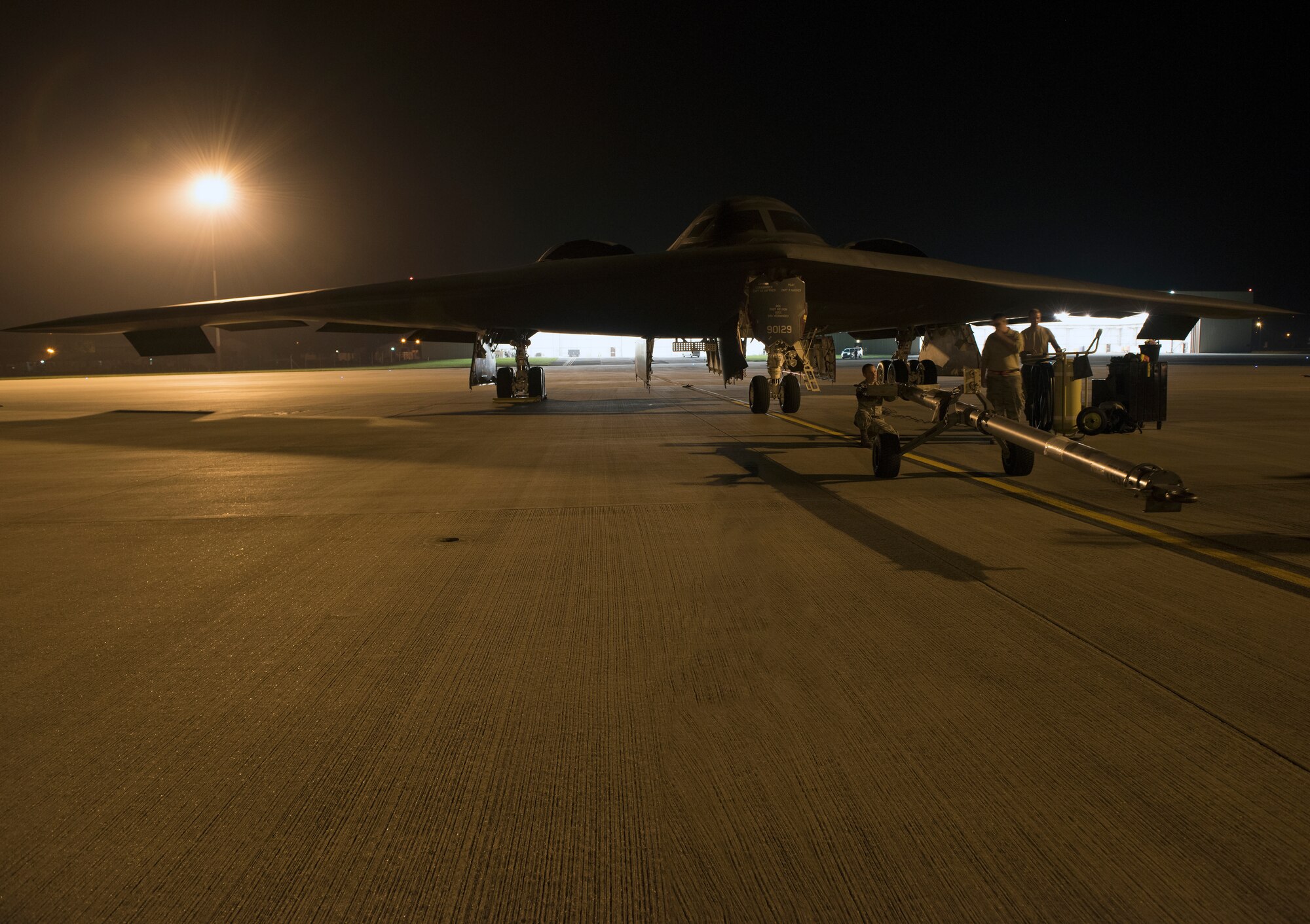 U.S. Air Force Staff Sgt. Richard Huartson, dedicated B-2 Spirit crew chief assigned to the 509th Bomb Wing at Whiteman Air Force Base, Missouri, prepares tow equipment on the flightline of Royal Air Force Fairford, England, on Aug. 27, 2019. A Bomber Task Force deployment of B-2s, Airmen and support equipment from the 509th Bomb Wing arrived in the U.S. European Command area of operations for a deployment to conduct theater integration and flying training. The deployment of strategic bombers to the United Kingdom helps exercise RAF Fairford as a forward operating base for the unit, ensuring they are engaged, postured and ready with credible force to assure, deter and defend the U.S. and its allies in an increasingly complex security environment. (U.S. Air Force photo by Staff Sgt. Kayla White)