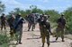 Airmen assigned to the 355th Maintenance Group practice tactical movement and communication during the first Field Expeditionary Combat Skills Training at Davis-Monthan Air Force Base, Arizona, Aug. 20, 2019. The 355th Security Forces Squadron worked in coordination with the MXG to ensure the readiness and ability of maintenance Airmen to be multi-functional so they can not only do their job, but defend the base and the assets of the Air Force in a near-peer fight. (U.S. Air Force photo by Airman 1st Class Jacob T. Stephens)