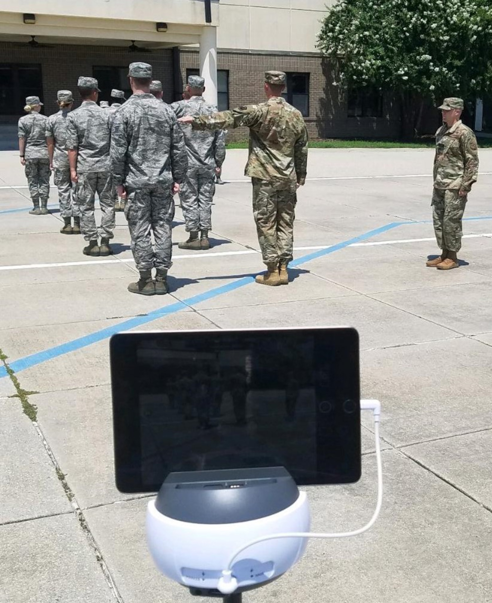 Military training leader course students conduct open ranks while using the Swivl video robot on Keesler Air Force Base, Mississippi, August 27, 2019. Swivl is a video robot designed to allow students to assess their own performance in the classroom, while increasing student engagement and supporting the Student-Centered Active Learning Environment with Upside-down Pedagogies learning model. Swivl gives students more ownership of their learning while reinforcing student interaction learning strategies: student-to-content, student-to-student, and student-to-instructor.