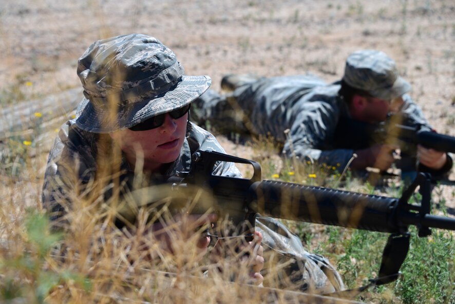 Airmen assigned to the 355th Maintenance Group practice firing positions during the first Field Expeditionary Combat Skills Training at Davis-Monthan Air Force Base, Arizona, Aug. 20, 2019. Airmen engaged in hands-on training that included firing positions, hand and arm signals, as well as tactical movements. (U.S. Air Force photo by Airman 1st Class Jacob T. Stephens)