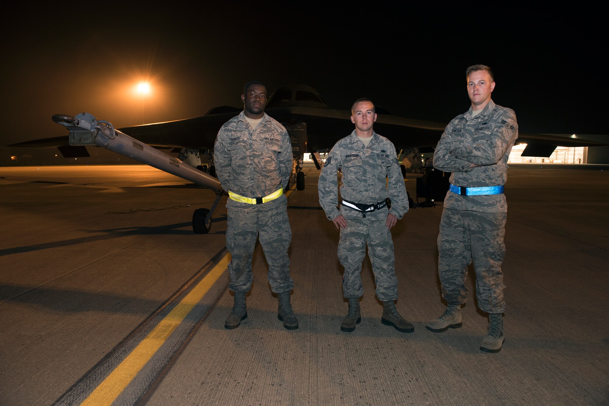 Senior Airman Markeece Powell, Staff Sgt. Richard Huartson and Airman 1st Class Austin Sawchuk, crew chiefs assigned to the 509th Bomb Wing at Whiteman Air Force Base, Missouri, stand for a photo in front of a B-2 Spirit on the flight line of Royal Air Force Fairford, England, on Aug. 27, 2019. A Bomber Task Force deployment of the stealth bomber aircraft, Airmen and support equipment from the 509th BW at Whiteman AFB, arrived in the U.S. European Command area of operations for a deployment to conduct theater integration and flying training. The deployment of strategic bombers to the United Kingdom helps exercise RAF Fairford as a forward operating base for the unit, ensuring they are engaged, postured and ready with credible force to assure, deter and defend the U.S. and its allies in an increasingly complex security environment. (U.S. Air Force photo by Staff Sgt. Kayla White)