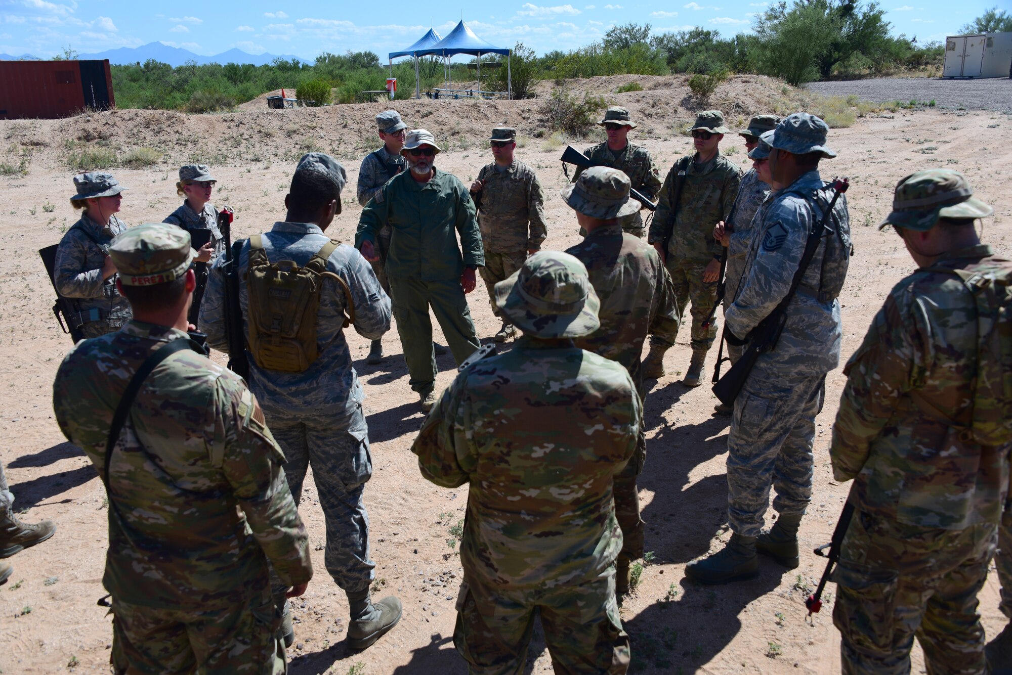 a photo of airmen learning about defense techniques for the installation