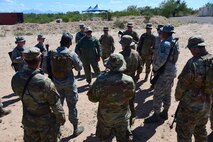 a photo of airmen learning about defense techniques for the installation