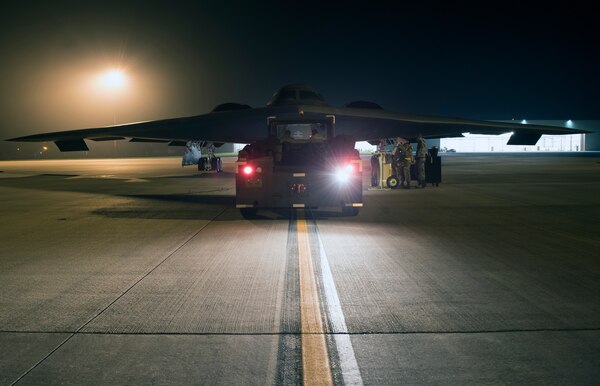 Crew chiefs assigned to the 509th Bomb Wing at Whiteman Air Force Base, Missouri, prepare a B-2 Spirit to be towed into a hangar at Royal Air Base Fairford, England, on Aug. 27, 2019. A Bomber Task Force deployment of B-2 Spirit stealth bomber aircraft, Airmen and support equipment from the 509th Bomb Wing at Whiteman AFB arrived in the U.S. European Command area of operations for a deployment to conduct theater integration and flying training. The deployment of strategic bombers to the United Kingdom helps exercise RAF Fairford as a forward operating base for the unit, ensuring they are engaged, postured and ready with credible force to assure, deter and defend the U.S. and its allies in an increasingly complex security environment. (U.S. Air Force photo by Staff Sgt. Kayla White)