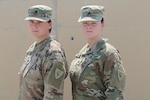 Staff Sgt. Justine Jones, a culinary specialist from Gary, Indiana, proudly stands with her sister, Sgt. Jenna Jones, aviation operations specialist from Gary, Indiana, Aug. 21, 2019. The sisters support Task Force Spartan, building lasting and trusting relationships with regional partners from Camp Arifjan, Kuwait.