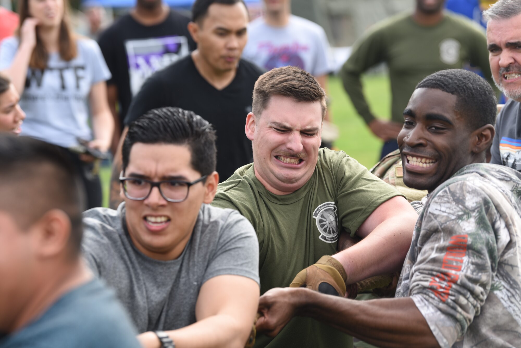 Airmen from the 90th Logistics Readiness Squadron compete in a  game of tug-of-war on Aug. 23, 2019, during the annual Frontiercade on F. E. Warren Air Force Base, Wyo. This annual event gives Airmen and their families a chance to come together to enjoy good food, friendly sports and games. (U.S. Air Force photo by Senior Airman Nicole Reed)