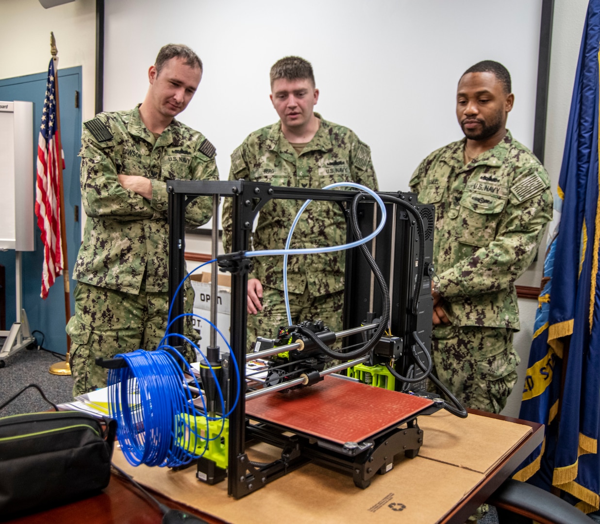 Sailors from NSWC PHD observe the printing phase of the LulzBot TAZ 6 3D Printing Machine during the Fleet Outreach Additive Manufacturing Course, July 16.