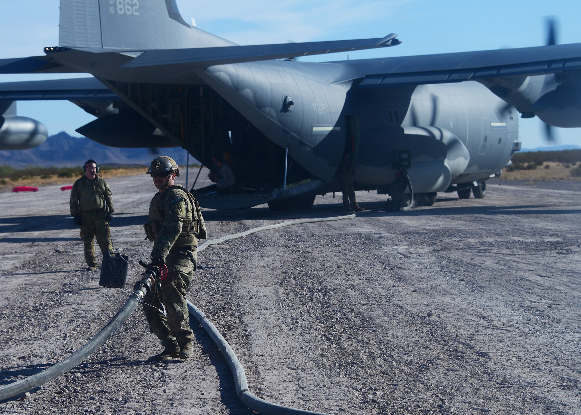 a photo of seamen practicing forward area refueling operations