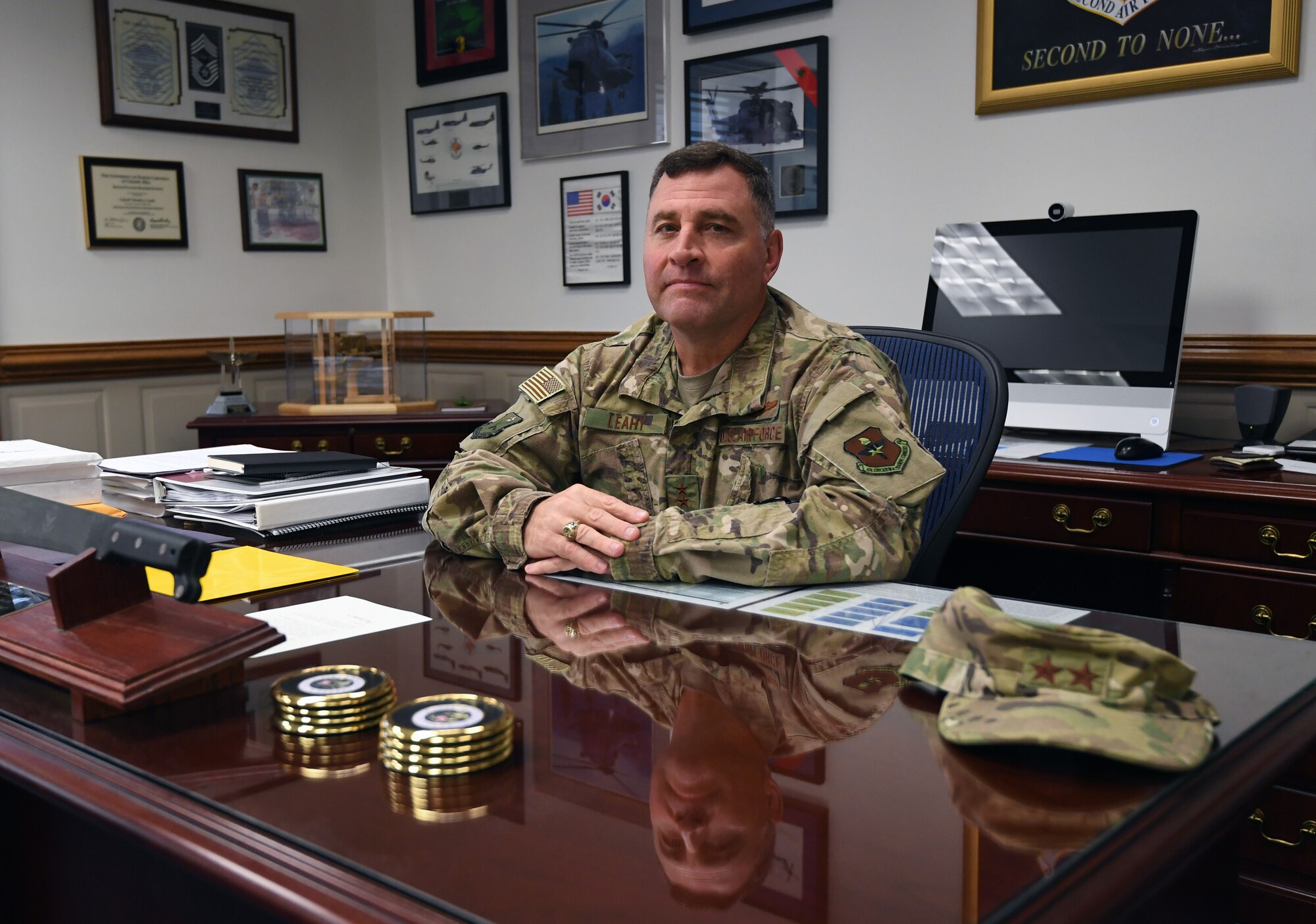 U.S. Air Force Maj. Gen. Timothy Leahy, Second Air Force commander, poses for a photo at his desk on Keesler Air Force Base, Mississippi, Aug. 14, 2019. Leahy will retire on Dec. 1 with more than 34 years of military service. Throughout his career, Leahy held positions at the major command, sub-unified combatant command and geographic and functional combatant command levels. He also commanded at the squadron, wing, center and numbered Air Force level. Additionally, Leahy is a command pilot with more than 3,200 hours of flight time, primarily in Special Operations Forces aircraft. (U.S. Air Force photo by Kemberly Groue)