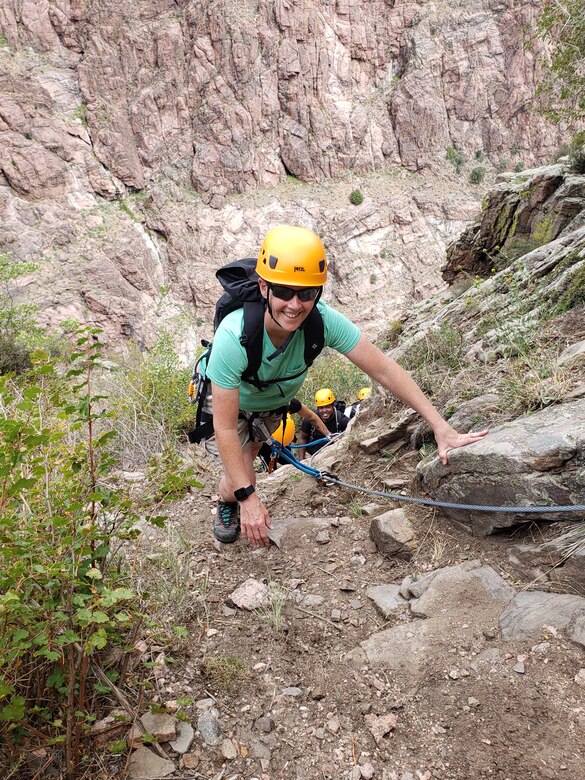 Juli Yim, Schriever Outdoor Recreation director, climbs a wall at the Royal Gorge Via Ferrata at Cañon City, Colorado, Aug. 24, 2019. The eight Airmen who joined the adventure experienced a guided tour through routes of different difficulties and scenic overlooks with mountain views. (U.S. Air Force photo by 2nd Lt. Idalí Beltré Acevedo)