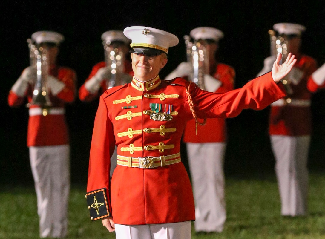 Warrant Officer Courtney Lawrence, operations officer and assistant director, “The Commandant’s Own” U.S. Marine Drum and Bugle Corps, performs during a Friday Evening Parade at Marine Barracks Washington, D.C., Aug. 23, 2019. Lawrence is the first female officer within the ranks of the Drum and Bugle Corps. Lieutenant Gen. Eric Smith, the commanding general, Marine Corps Combat Development Command, and the Deputy Commandant for Combat Development was the hosting official, and Mrs. Holly Carter Vega, the 2019 Armed Services Insurance Military Spouse of the Year, was the guest of honor.