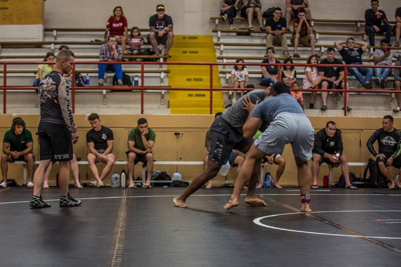 U.S. Marines stationed at Marine Corps Air Station (MCAS) Yuma and civilians from the Yuma community, participate in the Semper Fit Grappling Tournament at the station gym, August 23, 2019. The tournament consisted of four different catoregories based off weight and experience level. (U.S. Marine Corps photo by Cpl. Sabrina Candiaflores)
