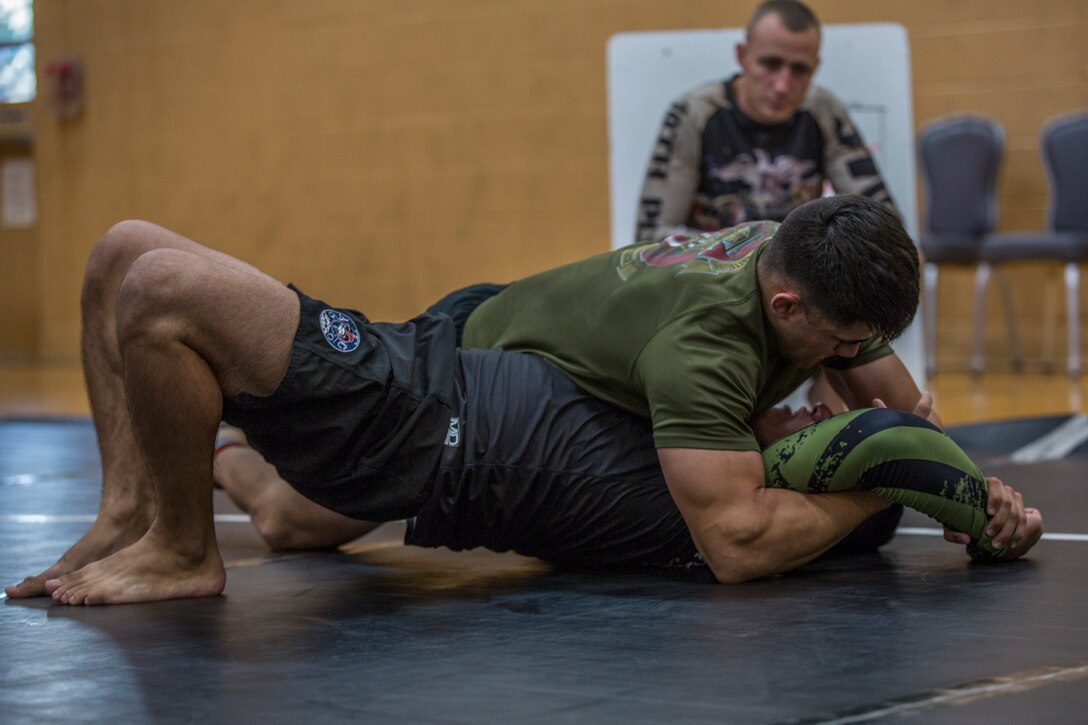 U.S. Marines stationed at Marine Corps Air Station (MCAS) Yuma and civilians from the Yuma community, participate in the Semper Fit Grappling Tournament at the station gym, August 23, 2019. The tournament consisted of four different catoregories based off weight and experience level. (U.S. Marine Corps photo by Cpl. Sabrina Candiaflores)