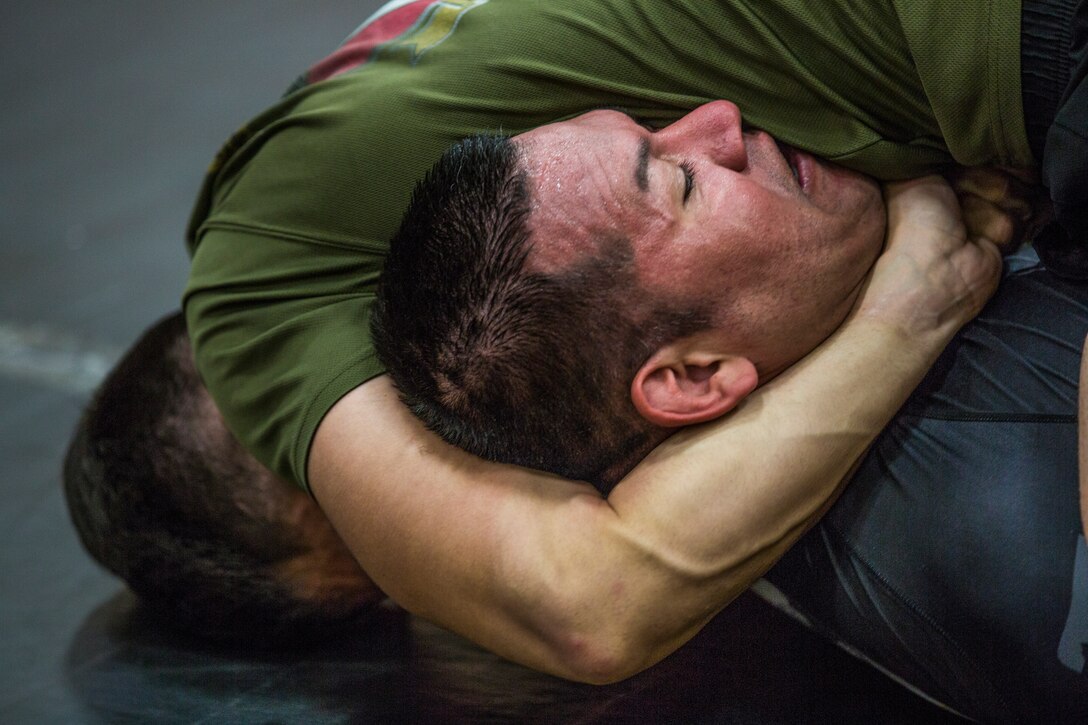 U.S. Marines stationed at Marine Corps Air Station (MCAS) Yuma and civilians from the Yuma community, participate in the Semper Fit Grappling Tournament at the station gym, August 23, 2019. The tournament consisted of four different catoregories based off weight and experience level. (U.S. Marine Corps photo by Cpl. Sabrina Candiaflores)