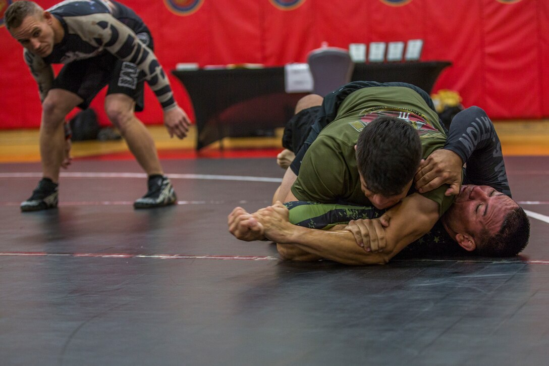 U.S. Marines stationed at Marine Corps Air Station (MCAS) Yuma and civilians from the Yuma community, participate in the Semper Fit Grappling Tournament at the station gym, August 23, 2019. The tournament consisted of four different catoregories based off weight and experience level. (U.S. Marine Corps photo by Cpl. Sabrina Candiaflores)