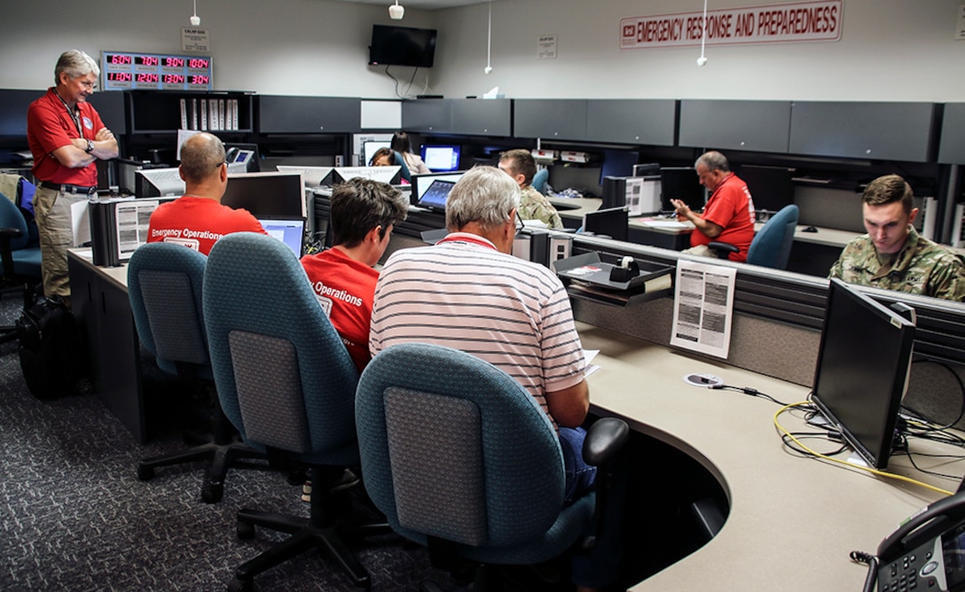 Members of the Emergency Management Team and the district Emergency Operations Center huddle to continue to coordinate today's deployment of 13 temporary power team members to Florida and Puerto Rico ahead of Tropical Storm Dorian anticipated landfall.