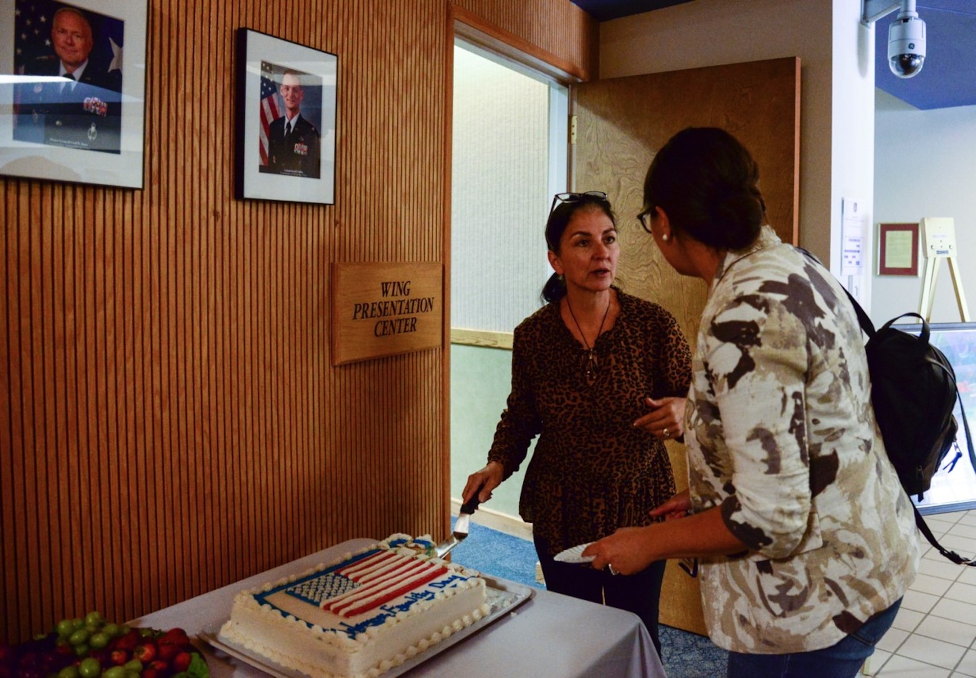 Cindy Dominguez-Trujillo, Special Assistant to the commander on Diversity and Affirmative Employment, cuts the cake during the Women’s Equality Day event at Kirtland Air Force Base, N.M., August 26, 2019. During the event, audience members watched various ‘TED’ talks, and received remarks from the 377th Air Base Wing Commander. (U.S. Air Force photo by Senior Airman Alexandria Crawford)