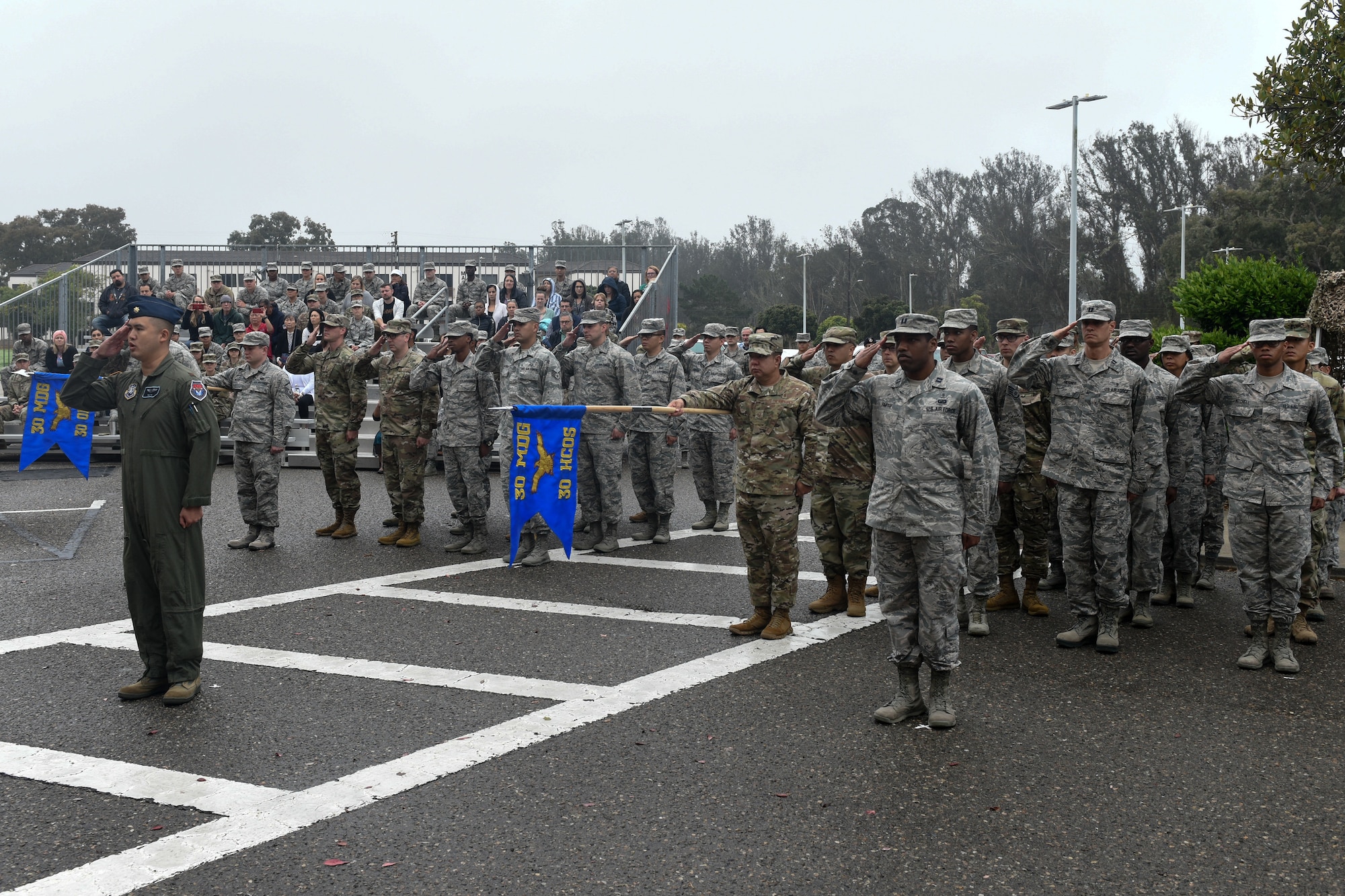 Airmen from the newly activated 30th Health Care Operations Squadron and redesignated 30th Operational Medical Readiness Squadron provide a presentation of the group during the 30th Medical Group reorganization ceremony Aug. 23, 2019, at Vandenberg Air Force Base, Calif.