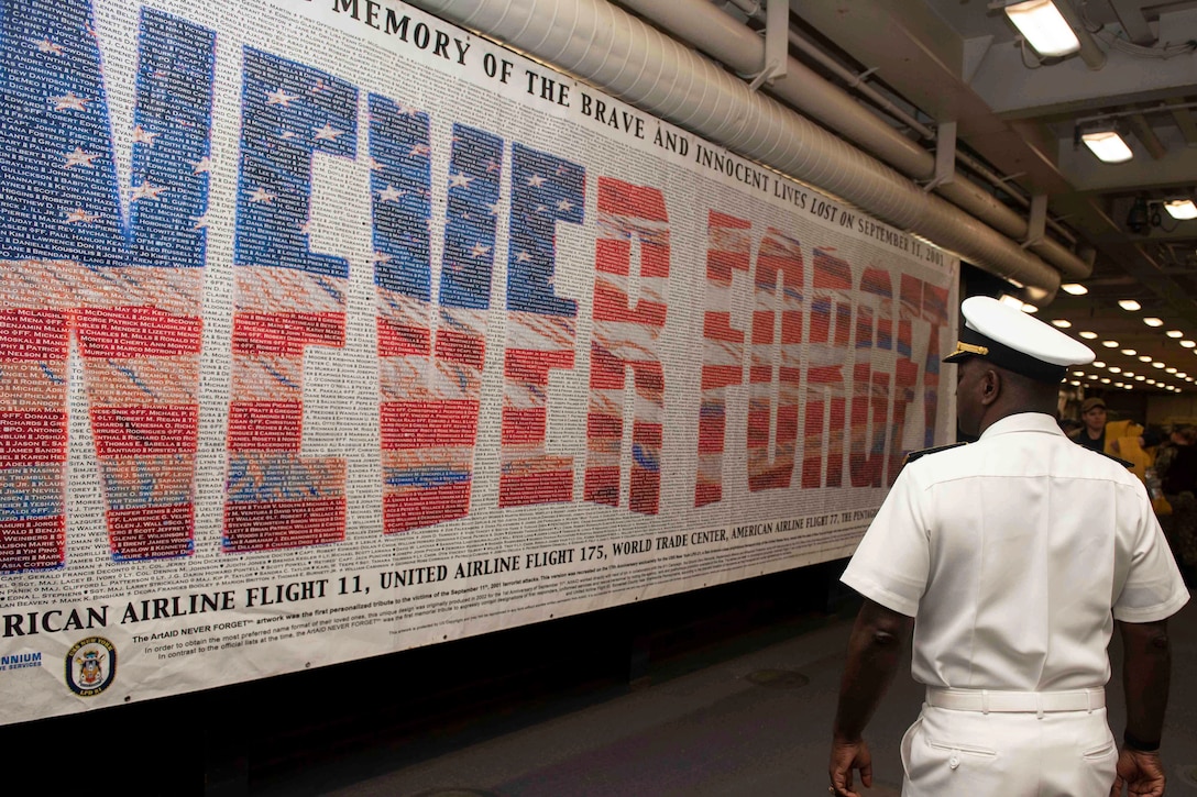 Navy admiral views never forget banner.