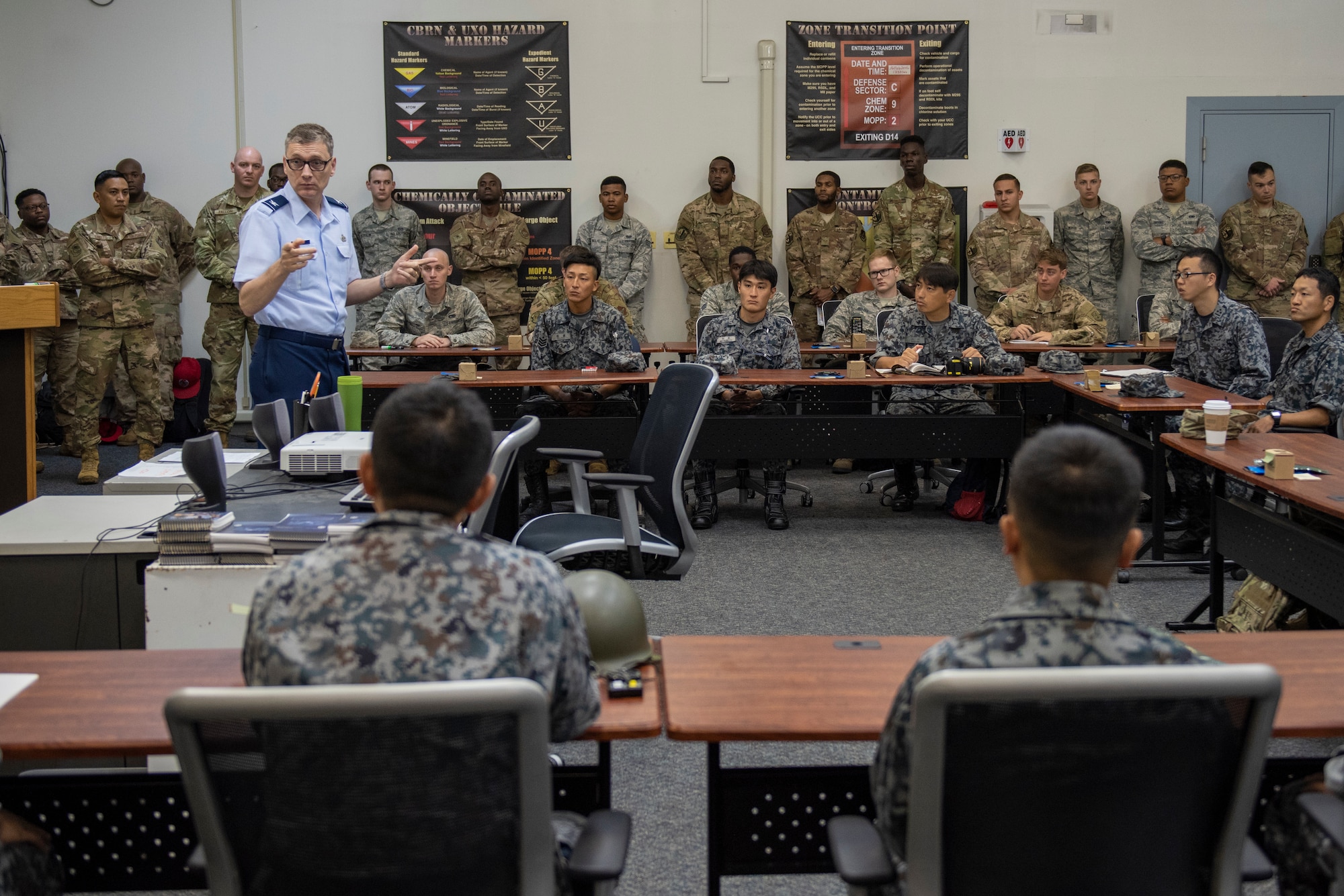 U.S. Air Force Col. David McCleese, 5th Air Force A4 director, speaks with the participants of Pacific Unity 2019 about the importance of the event prior to the classroom portion commencing at Yokota Air Base, Japan, August 20, 2019.