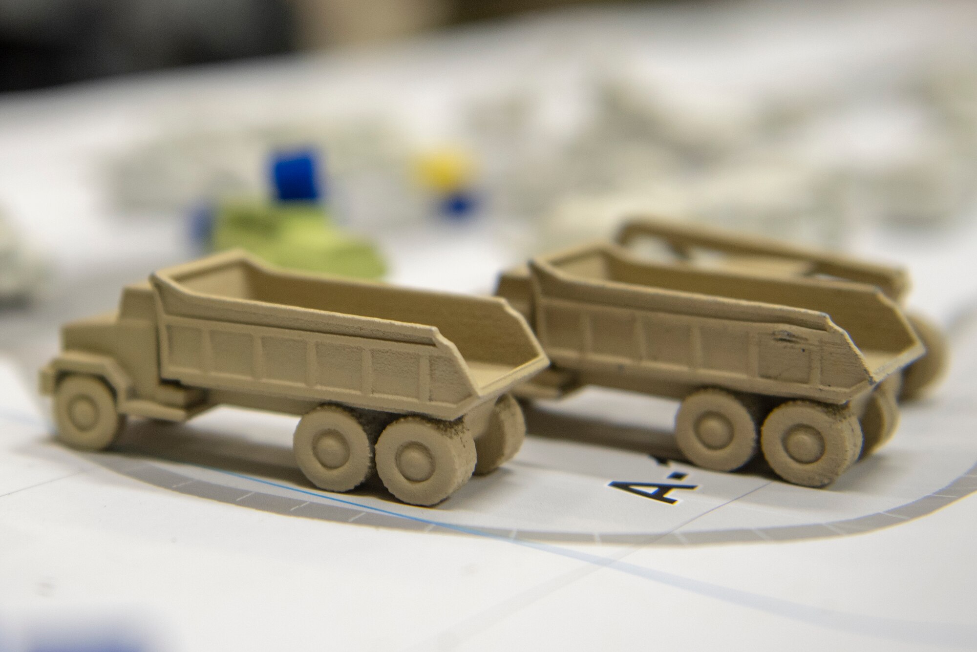 A pair of wooden equipment replicas symbolize material in transit during the table top portion of Pacific Unity 2019 at Yokota Air Base, Japan, August 21, 2019.