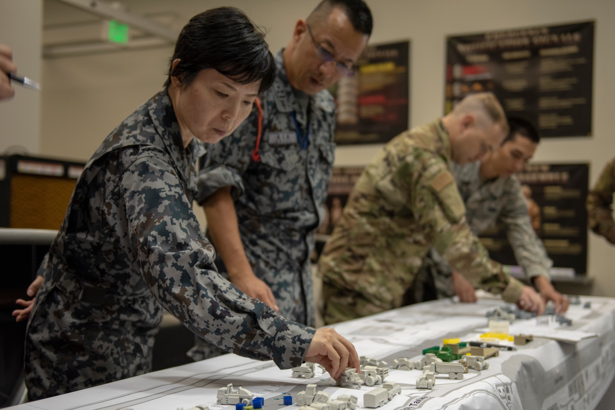 Japan Air Self-Defense Force and U.S. Air Force service members take part in the table top portion of Pacific Unity 2019 at Yokota Air Base, Japan, August 21, 2019.