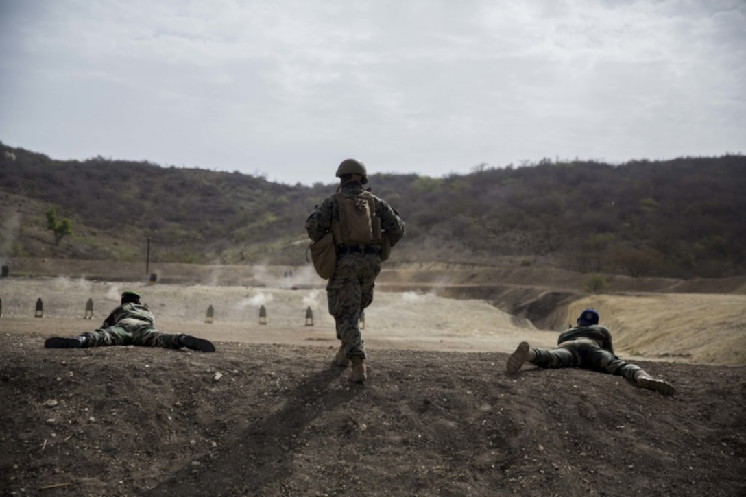 A U.S. Marine with Special Purpose Marine Air-Ground Task Force-Crisis Response-Africa 19.2, Marine Forces Europe and Africa, observes as a personal safety officer for Senegalese soldiers during a training exercise in Dakar, Senegal, Aug. 3, 2019. SPMAGTF-CR-AF is deployed to conduct crisis-response and theater-security operations in Africa and promote regional stability by conducting military-to-military training exercises throughout Europe and Africa. (U.S. Marine Corps photo by Cpl. Margaret Gale)