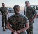 A U.S. Marine with Special Purpose Marine Air-Ground Task Force-Crisis Response-Africa 19.2 receives a command coin from Maj. Gen. Patrick J. Hermesmann, right, the commander of Marine Forces Europe and Africa, during a visit to Moron Air Base, Spain, Aug. 20, 2019. The Marine received the coin for her superior performance and dedication during the deployment. Hermesmann spoke with the deployed Marines and Sailors of SPMAGTF-CR-AF about their mission and role as a crisis response force. (U.S. Marine Corps photo by Cpl. Gumchol Cho)