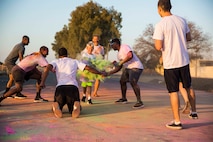 Marines with Special Purpose Marine Air-Ground Task Force-Crisis Response-Africa 19.2, Marine Forces Europe and Africa, volunteer during a color run on Moron Air Base, Spain, Aug. 14, 2019. The event allowed the members of the base to participate in a run throughout the base increasing unit cohesion, morale, and team-building skills of service members and patrons aboard the base. SPMAGTF-CR-AF is deployed to conduct crisis-response and theater-security operations in Africa and promote regional stability by conducting military-to-military training exercises throughout Europe and Africa. (U.S. Marine Corps photo by Cpl. Margaret Gale)