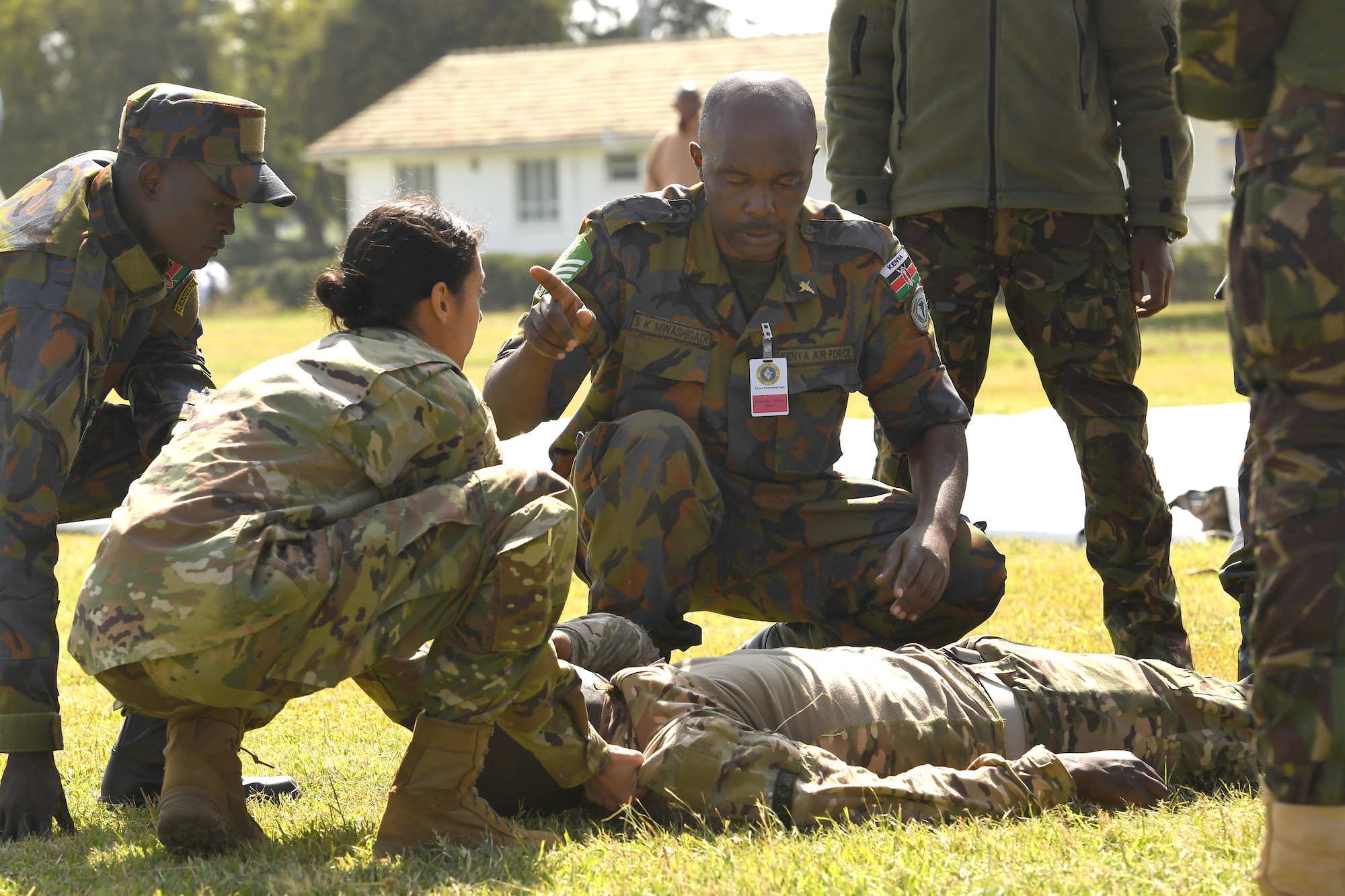 U.S. Air Force Senior Airman Daniela Rizzari, 104th Fighter Wing, Massachusetts Air National Guard medical technician, reviews checking airways with Kenya air force nurse Senior Sgt. Sospeter Mwashigadi, during a tactical combat casualty care demonstration at the African Partnership Flight Kenya 2019 event, Laikipia Air Base, Kenya, August 21, 2019.