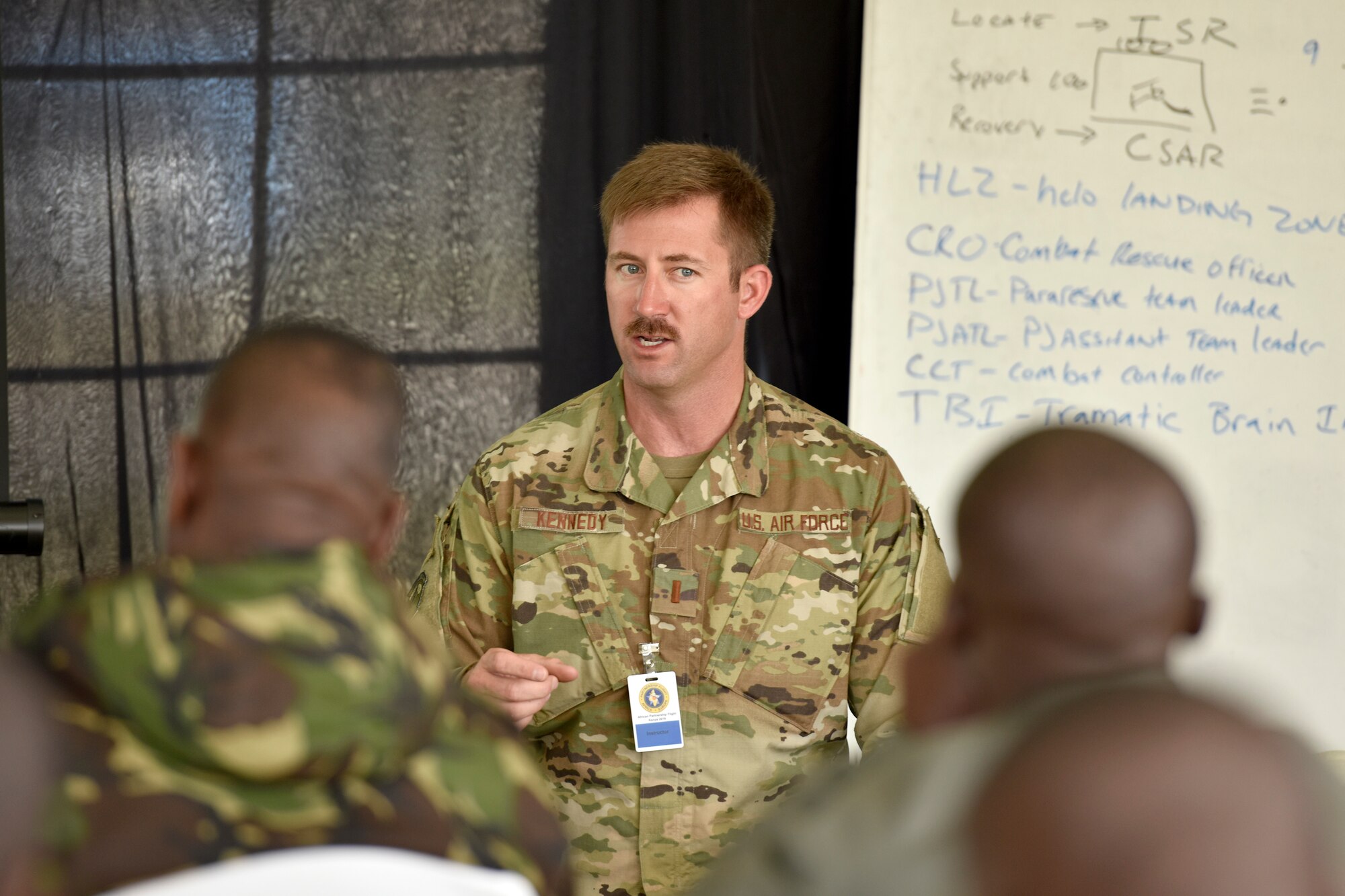 U.S. Air Force 2nd Lt. Michael Kennedy, 82nd Expeditionary Rescue Squadron combat rescue officer, shares best practices on casualty collection points during the African Partnership Flight Kenya 2019 event at Laikipia Air Base, Kenya, August 22, 2019.