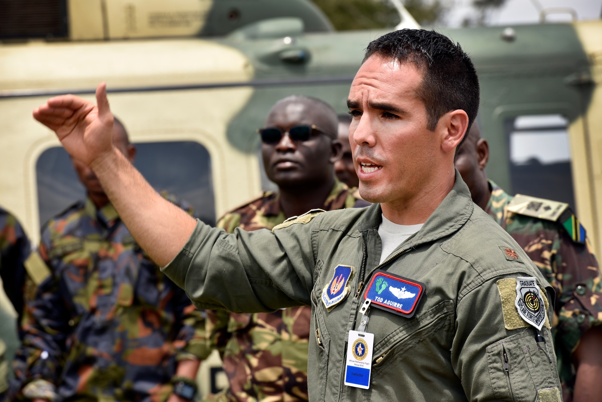 U.S. Air Force Maj. Anibal Aguirre, U.S. Air Forces in Europe and Air Forces Africa personnel recovery coordination cell director, offers feedback after a practical personnel recovery demonstration at the African Partnership Kenya 2019 program held at Laikipia Air Base, Kenya.