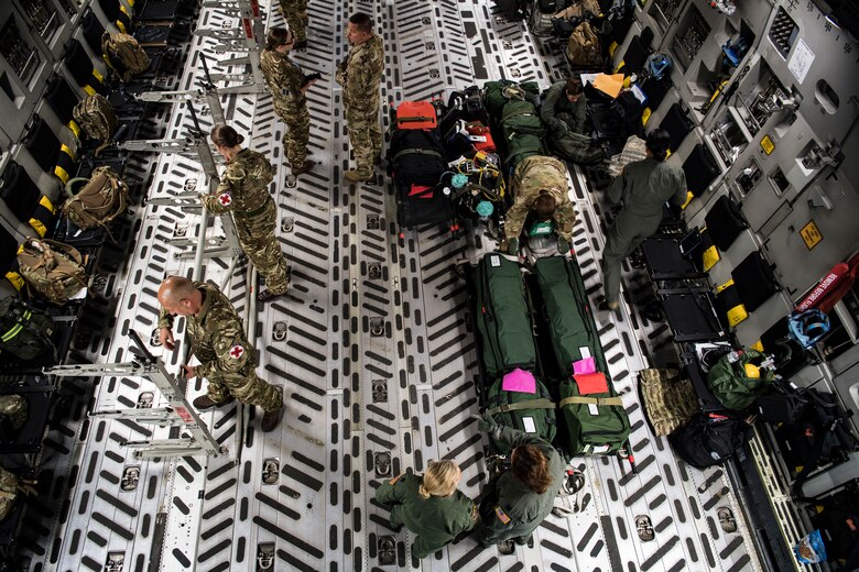Reserve Citizen Airmen participating in Patriot Warrior 2019 conduct a training scenario at Fort McCoy, Wisconsin, Aug. 16, 2019. Patriot Warrior is Air Force Reserve Command's premier exercise, providing Airmen an opportunity to train with joint and international partners in airlift, aeromedical evacuation and mobility support. The exercise builds on capabilities for the future fight, increasing the readiness, lethality and agility of the Air Force Reserve. (U.S. Air Force Photo by Tech. Sgt. Gregory Brook)