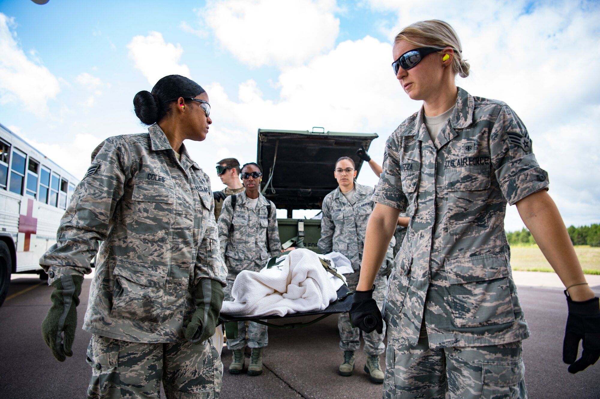 Airmen conduct a training scenario during Patriot Warrior 2019 at Fort McCoy, Wisconsin, Aug. 16, 2019. Patriot Warrior is Air Force Reserve Command's premier exercise, providing Airmen an opportunity to train with joint and international partners in airlift, aeromedical evacuation and mobility support. The exercise builds on capabilities for the future fight, increasing the readiness, lethality and agility of the Air Force Reserve. (U.S. Air Force Photo by Tech. Sgt. Gregory Brook)