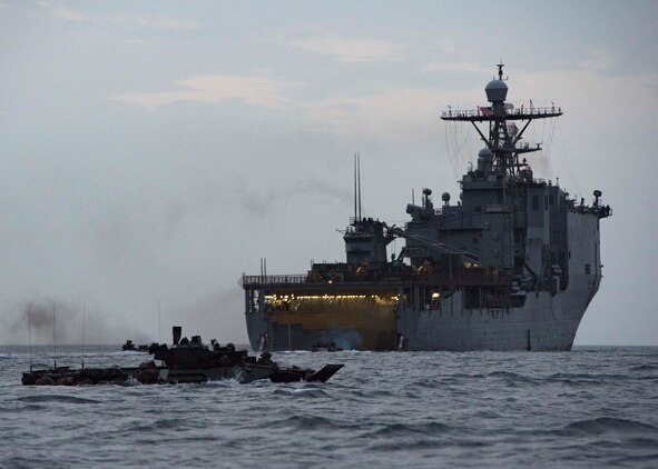 Assault Amphibious Vehicles assigned to the 11th Marine Expeditionary Unit cruise towards land after exiting the well deck of the amphibious dock landing ship USS Harpers Ferry. Harpers Ferry is part of the Boxer Amphibious Ready Group and 11th MEU and is deployed to the U.S. 5th Fleet area of operations in support of naval operations to ensure maritime stability and security in the Central Region, connecting the Mediterranean and the Pacific through the Western Indian Ocean and three strategic choke points.