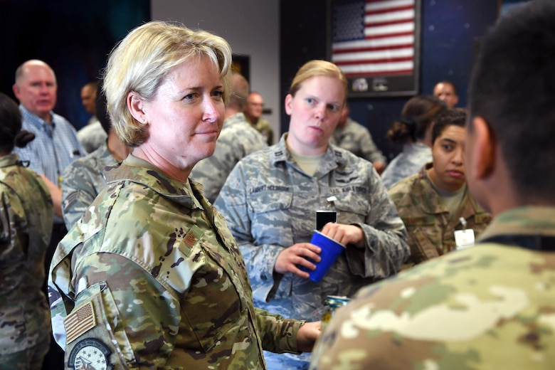 Brig. Gen. DeAnna Burt, Air Force Space Command Headquarters director of operations and communications, discusses career options with Airmen at Schriever Air Force Base, Colorado, Aug. 26, 2019. Burt, who served as the 50th Space Wing commander from May 2015 to July 2017, volunteered to mentor Schriever AFB personnel during Mentor Monday at Bennie’s Breakroom. (U.S. Air Force photo by Dennis Rogers)