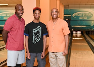 Jemal Murray, Big Brothers Big Sisters mentor, Cory Johnson, BBBS mentee and Kevin Warrick, retired U.S. Air Force, pose for a photo at Langley Lanes on Joint Base Langley-Eustis, Virginia, Aug. 14, 2019.