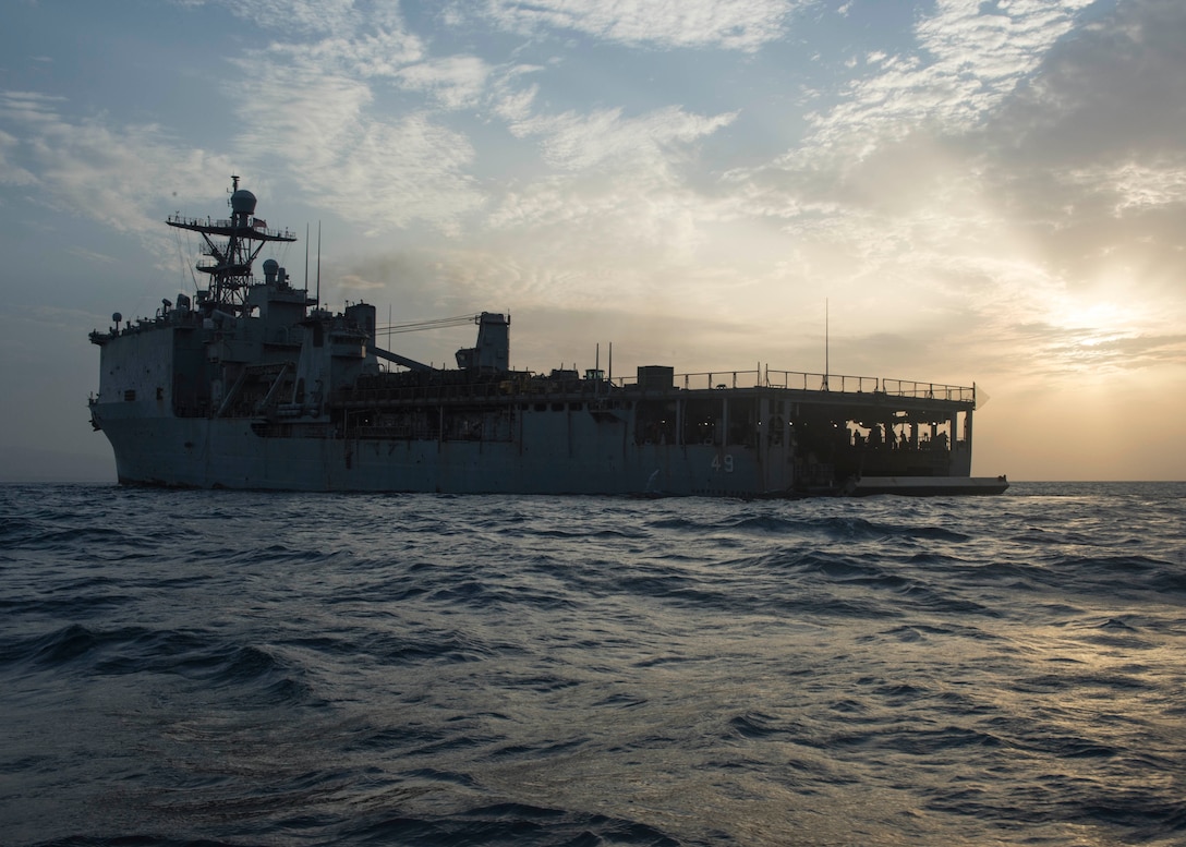 The stern gate opens to the well deck of the amphibious dock landing ship USS Harpers Ferry for amphibious operations. Harpers Ferry is part of the Boxer Amphibious Ready Group and 11th Marine Expeditionary Unit and is deployed to the U.S. 5th Fleet area of operations in support of naval operations to ensure maritime stability and security in the Central Region, connecting the Mediterranean and the Pacific through the Western Indian Ocean and three strategic choke points.