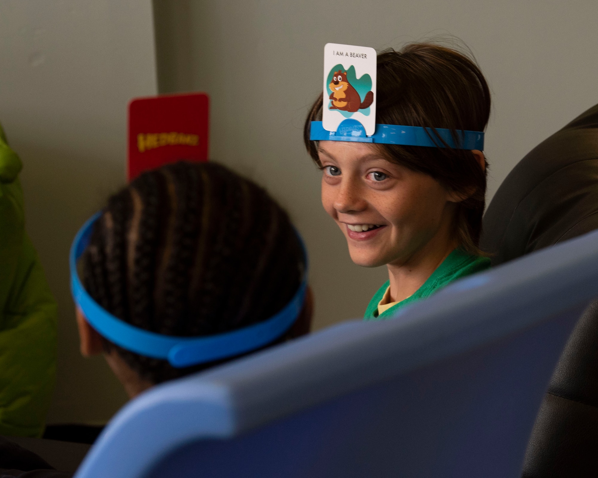 A Team Shaw child laughs with a peer during a game at Shaw Air Force Base, South Carolina, July 29, 2019.