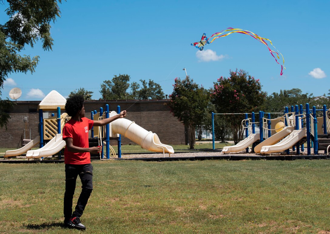 A Team Shaw child flies a kite during a week-long Youth Resiliency Camp at Shaw Air Force Base, South Carolina, July 30, 2019.