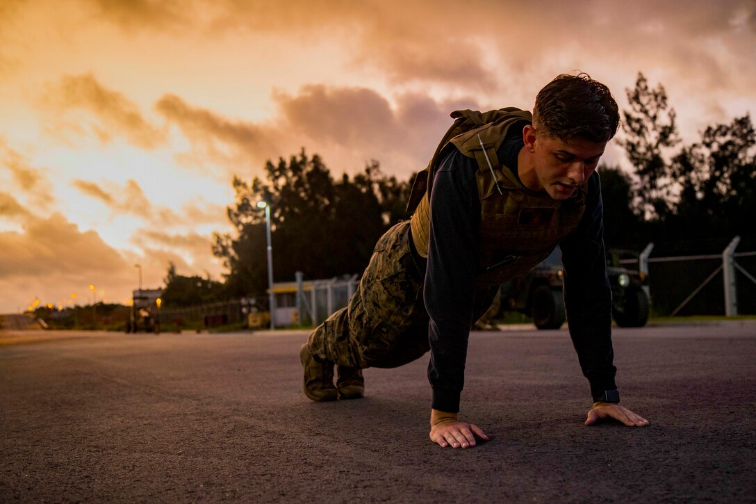 A Marine in a pushup position.