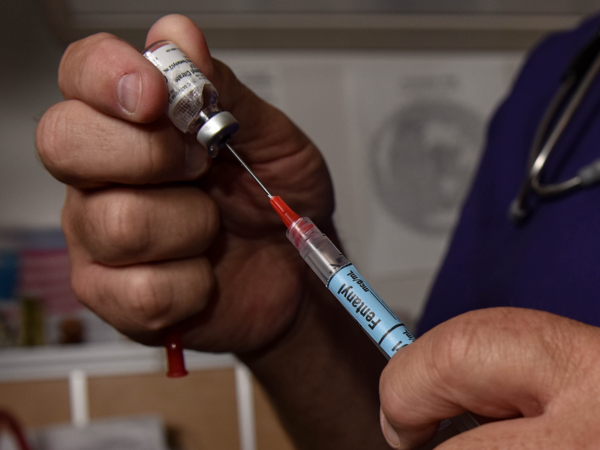 Jeffrey Barbour, 633rd Medical Group same day surgery and post anesthesia unit, prepares a needle at Joint Base Langley-Eustis, Virginia, August 16, 2019