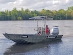 A deputy from Missouri’s Osage County Sheriff office operates a former Coast Guard vessel during spring floods. The craft was obtained through the 1033 program that is administered through DLA Disposition Services.