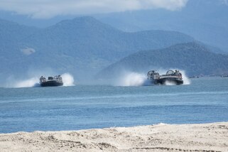 U.S. Navy Landing Craft Air Cushions conduct ship-to-shore operations.