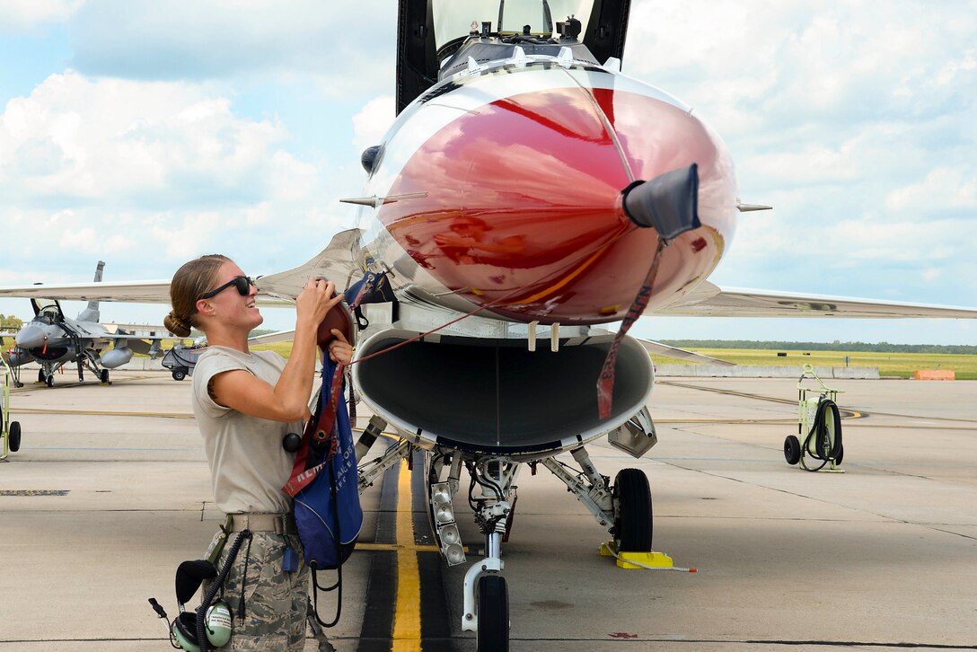 An airman works on an aircraft.