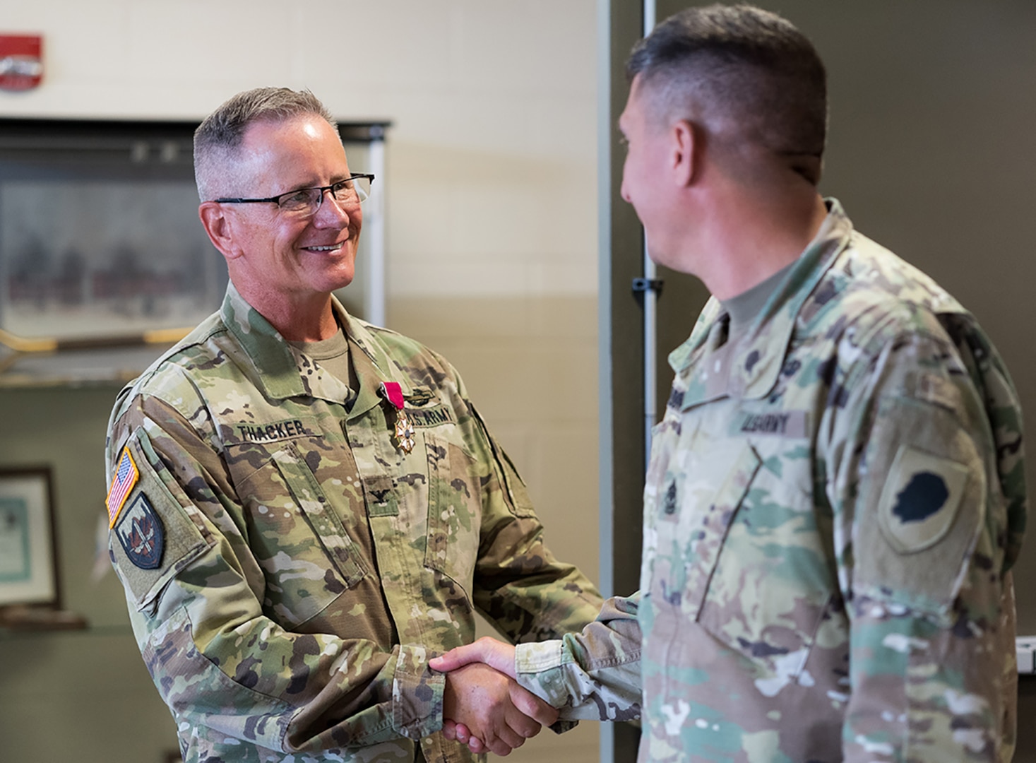 Friends congratulate Col. Rodney Thacker following his retirement ceremony, Aug. 23 at the Illinois Military Academy, Camp Lincoln, Springfield, Illinois.