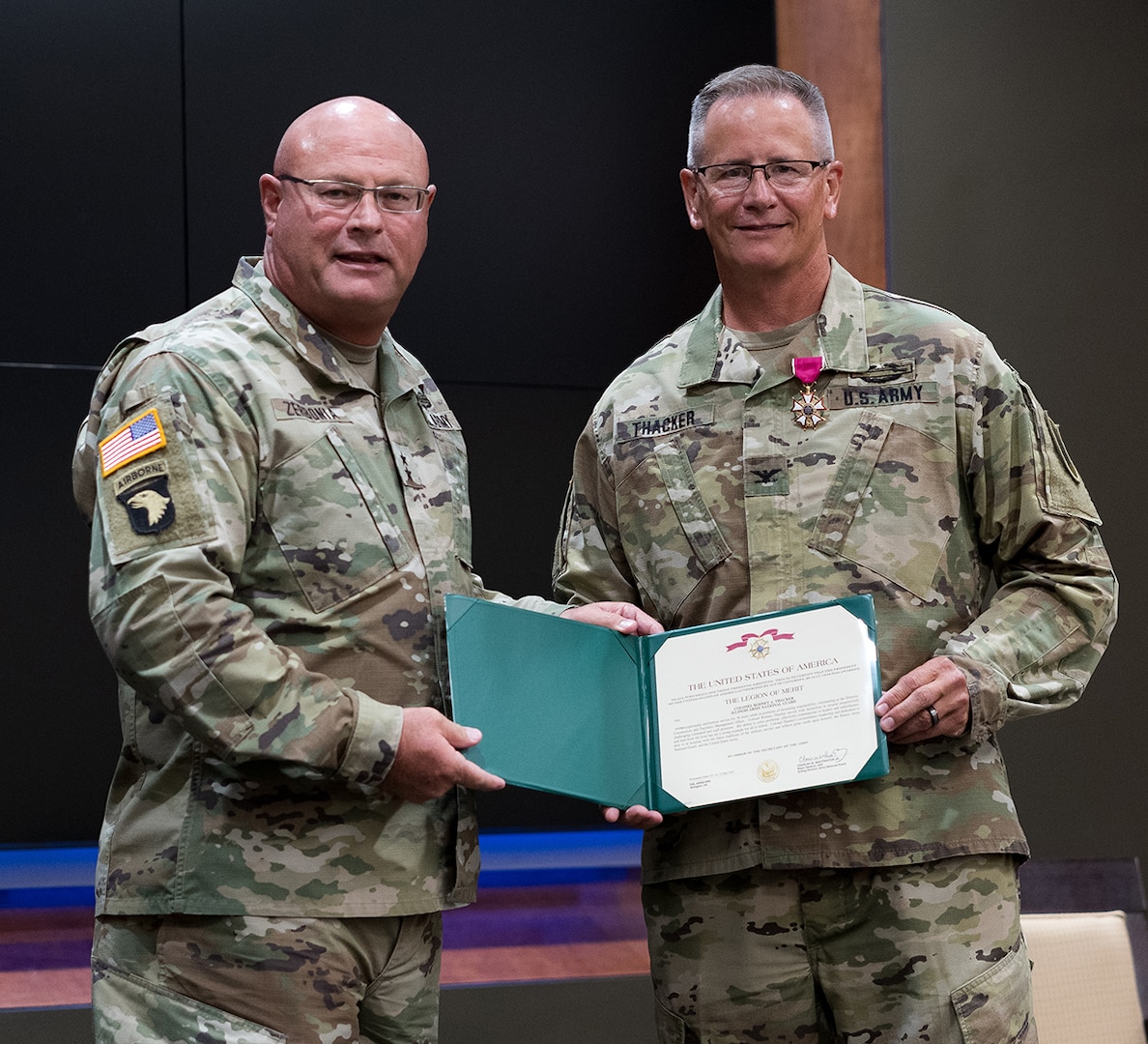 Maj. Gen. Michael R. Zerbonia, Assistant Adjutant General-Army, Illinois National Guard, presents Col. Rodney Thacker with the Legion of Merit.