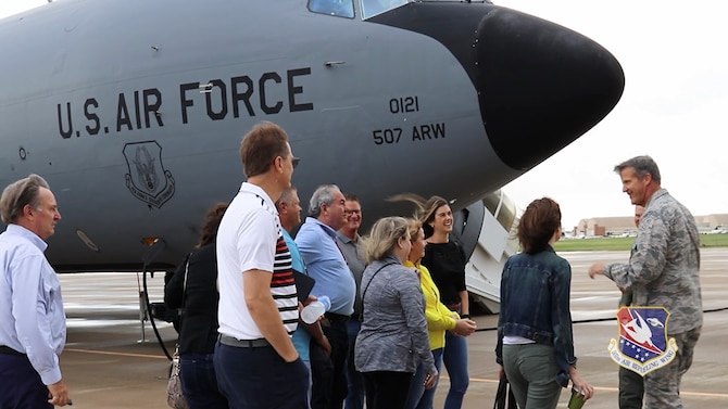 Honorary commanders from Tinker Air Force Base, Oklahoma, and Brig. Gen. Christopher Hill, Oklahoma City Air Logistics Complex commander, stand by a KC-135R Stratotanker before an orientation flight, Aug. 23, 2019. (U.S. Air Force photo by Senior Airman Mary Begy)