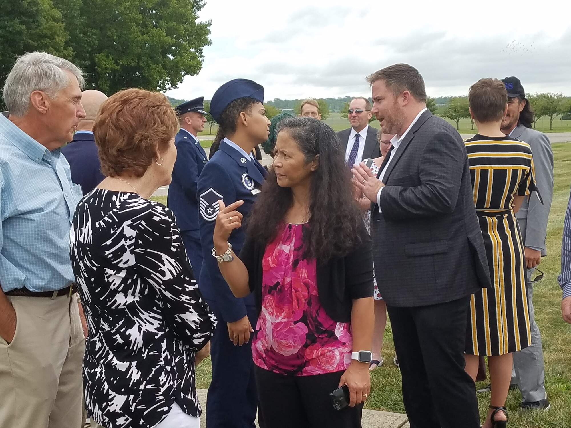 Family, friends and coworkers visit with each other at Memorial Gardens after the ceremony for the 603rd Air Control Squadron members. (U.S. Air Force photo/Laura McGowan)